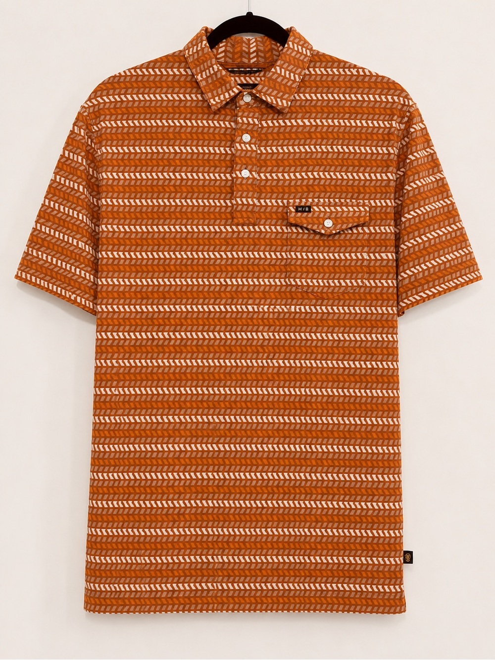 Howler Bros. Men’s Burnt Orange Geo-Stripe Short Sleeve Polo